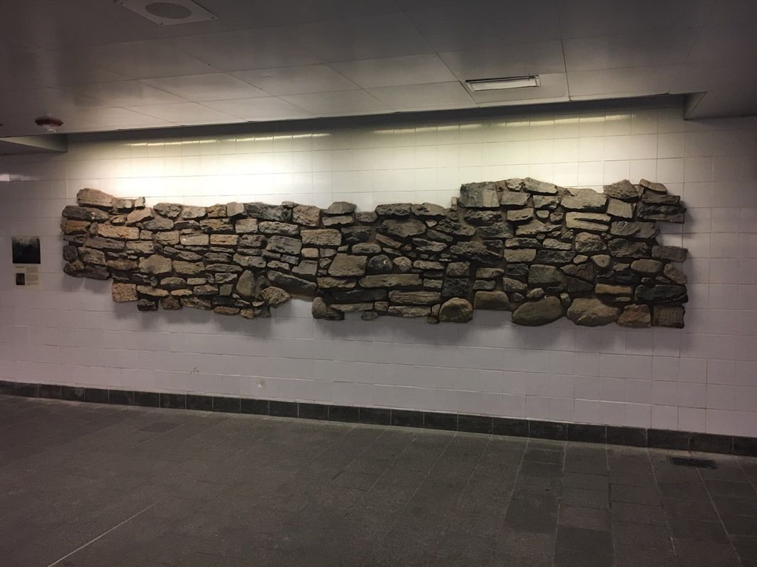 The excavated 18th-century battery wall embedded in the South Ferry subway station